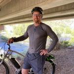 Jeff on bike by river born tough shirt2