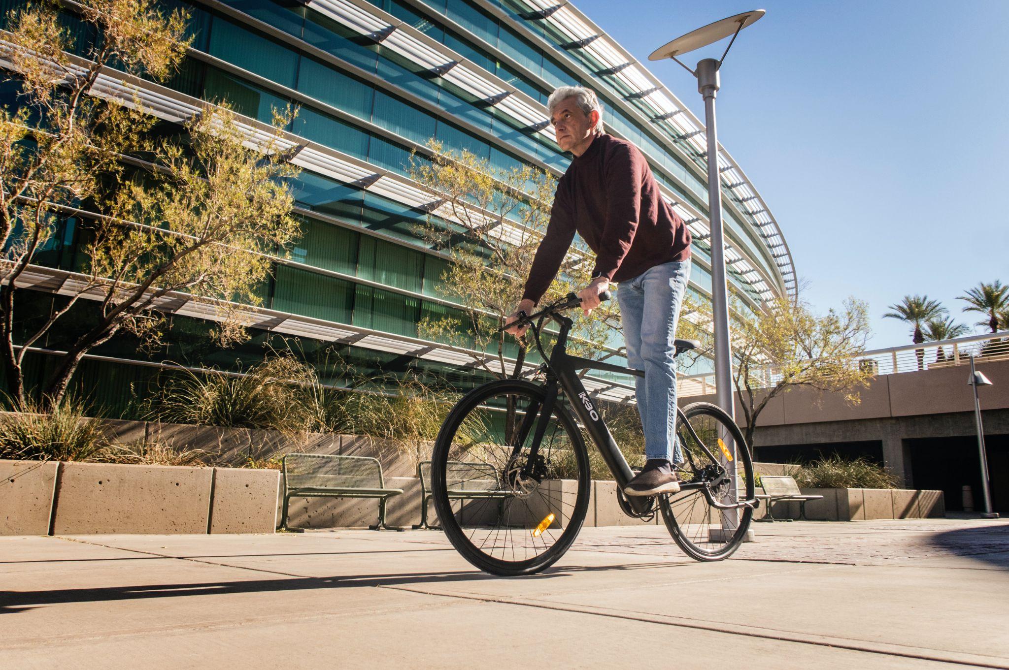 Older man on a bike in the city