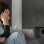 Women living with Chronic Pain holding head and stomach.