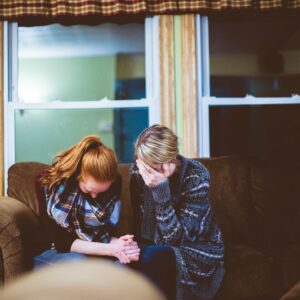 man and woman on couch sad ben white e92L8PwcHD4 unsplash