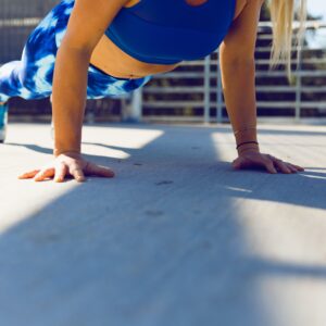 Woman's Core in blue outfit plank position ayo ogunseinde 3GFOT3sgg4Y unsplash