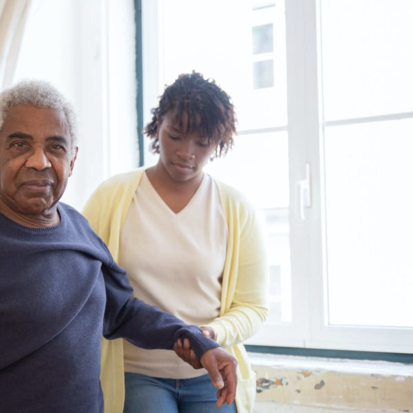 Woman helping older man with his arm. caregivers need good care too