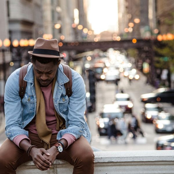 black man sitting on bridge looking sad whoislimos kFVmYjK6hZ8 unsplash